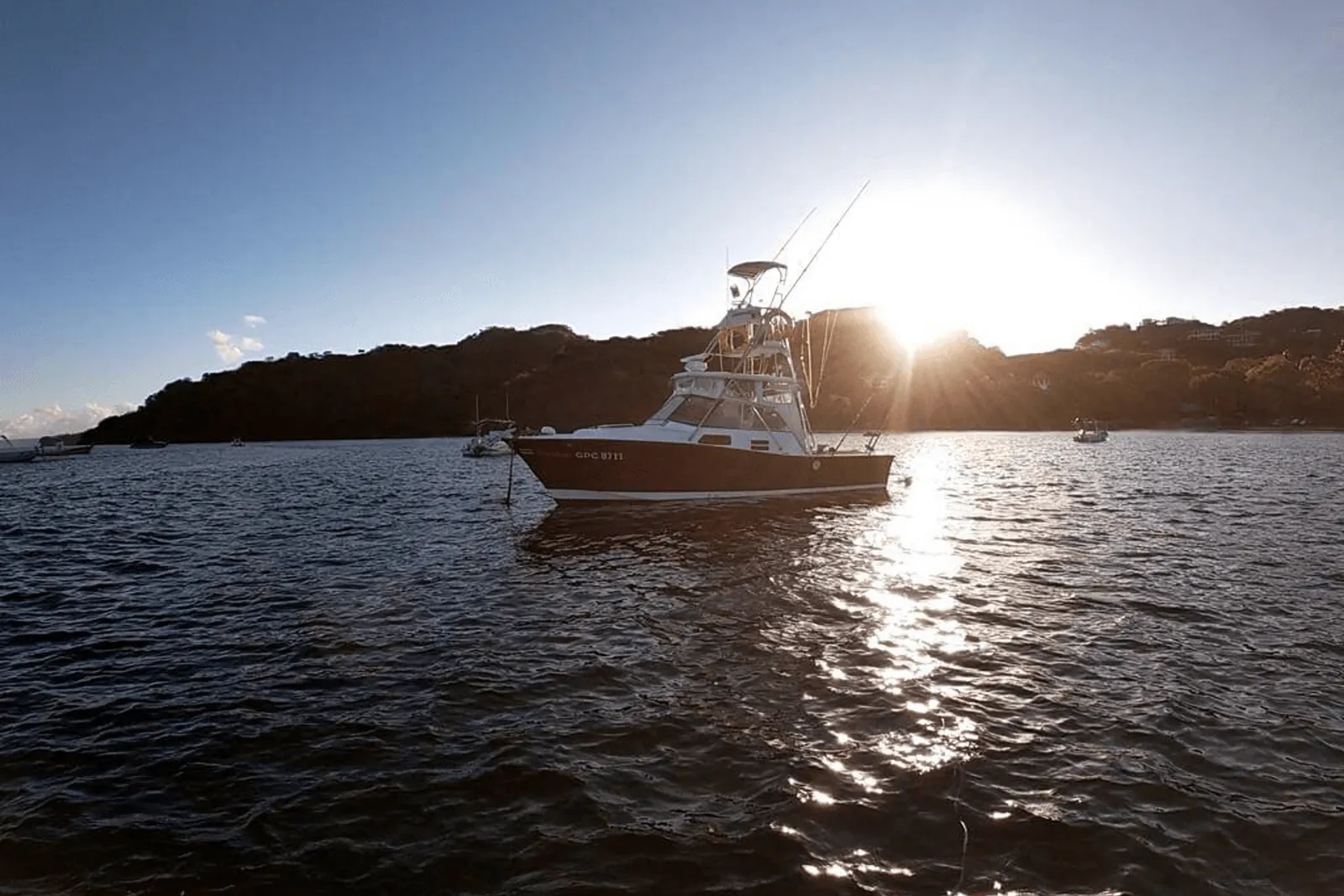 The Freedom, the family boat, anchored off Playa Flamingo at sunset