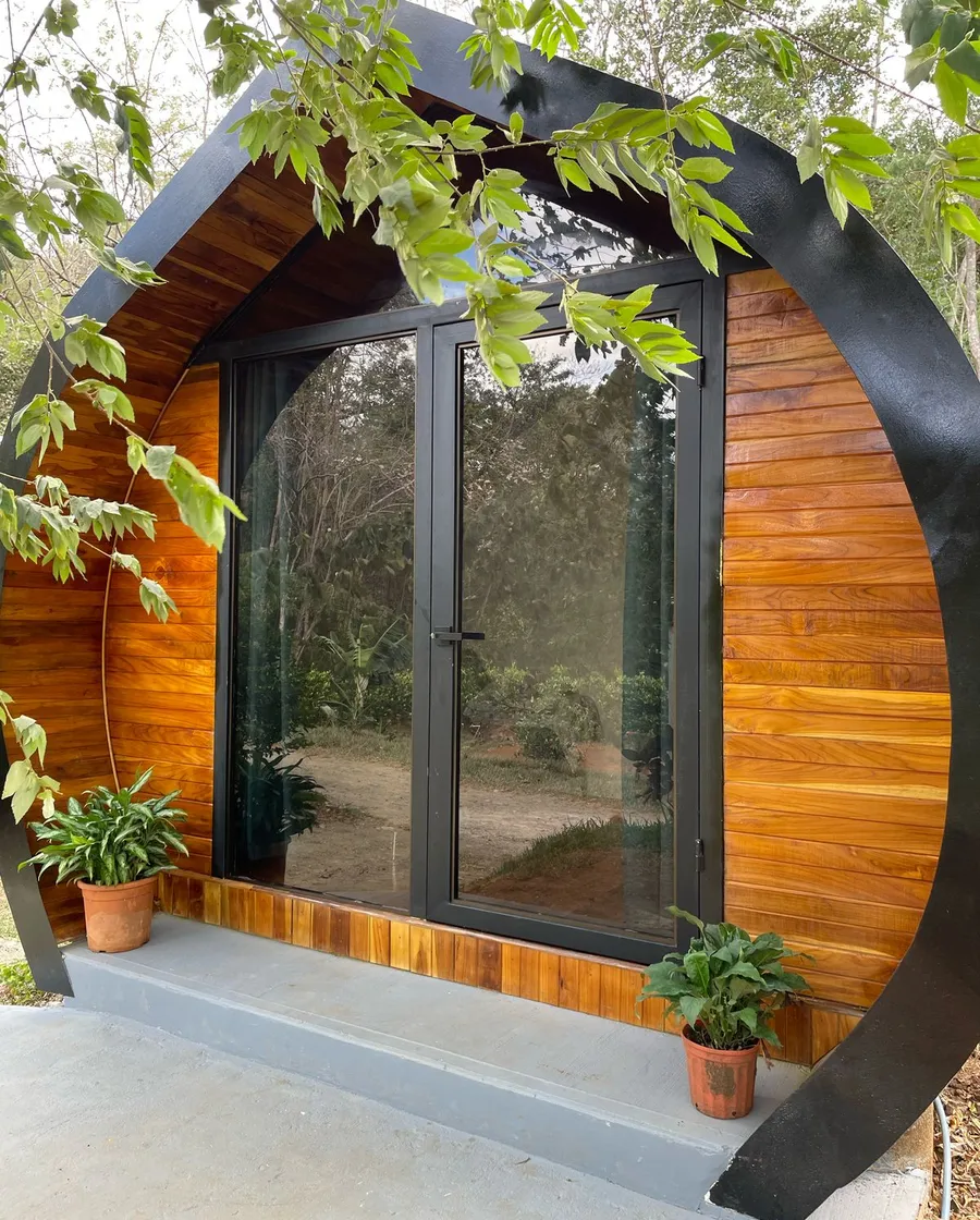 The front of a capsule cabin, framed in teak
